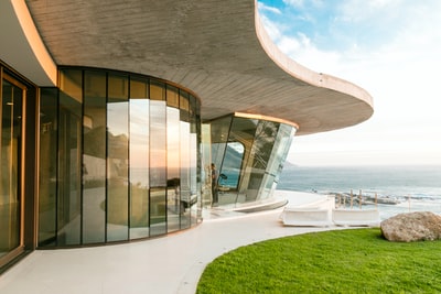 brown concrete building near sea during daytime